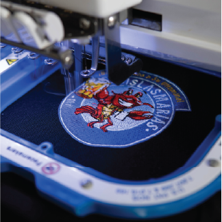 Embroidery machine stitching a custom patch
