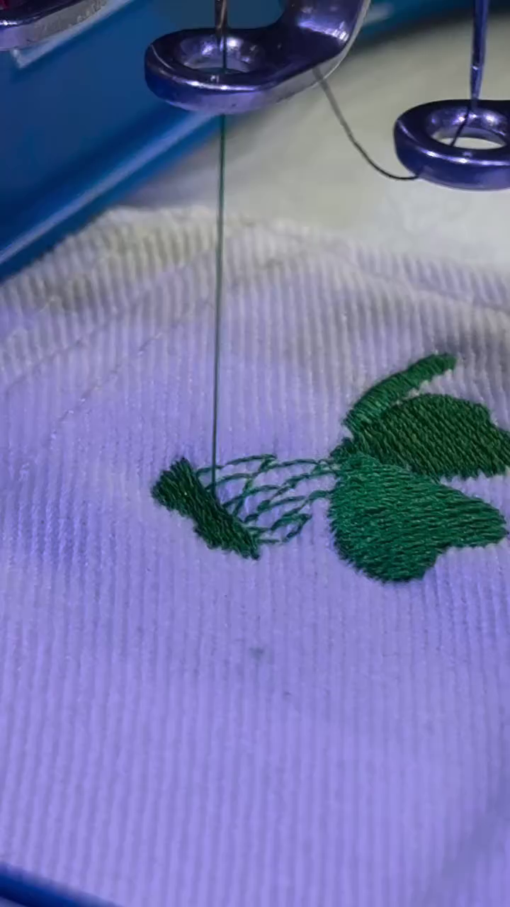 Green thread embroidery closeup