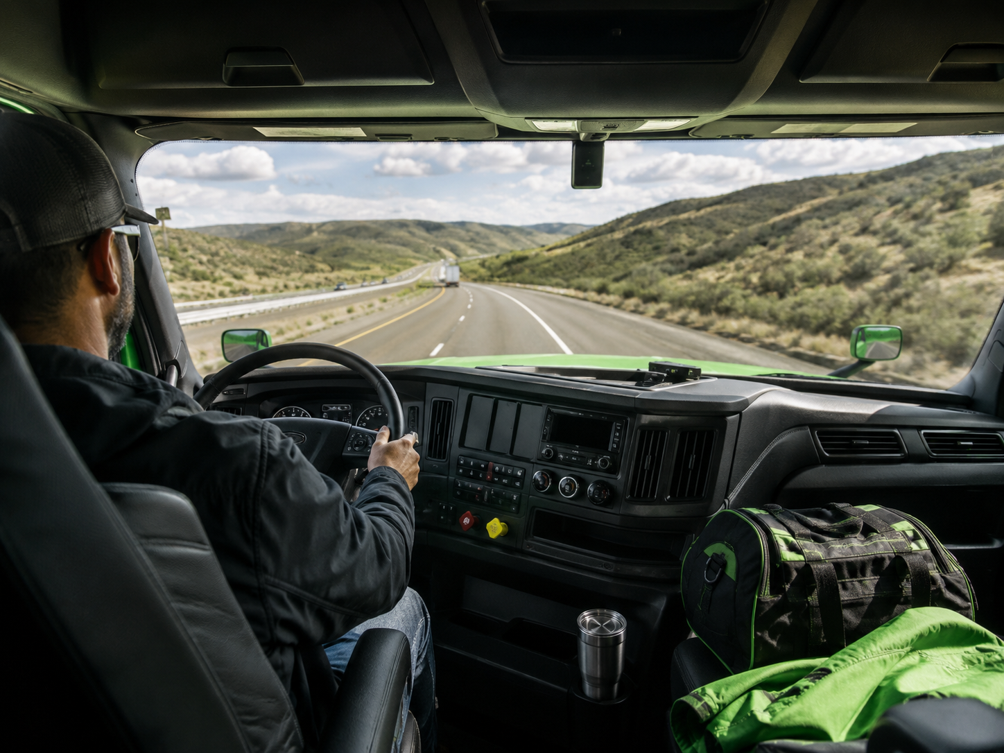 Scenic highway view from inside the truck cab representing open road flexibility