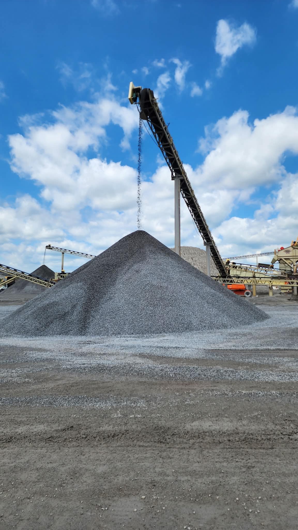 Conveyor discharging stone